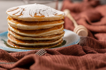 Pancakes Close Up, Delicious breakfast of pancakes with honey and sugar powder, close up view