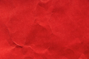 Texture and background of crumpled red paper. Red backdrop. Empty template and mockup for designers. 