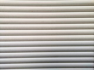 Obraz premium Metal Blinds with drawstring. Roller Shutter Background
