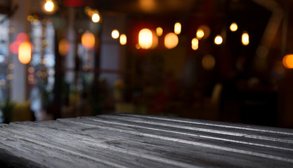 blurred background of bar and dark brown desk space of retro wood