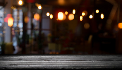 blurred background of bar and dark brown desk space of retro wood