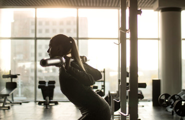 Woman of middle age working out in gym.