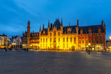 Fototapeta na wymiar Provincial Court building on market square (Grote markt) at night, Bruges, Belgium