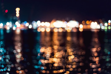 the seaport lights are out of focus. seawater reflection