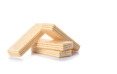 Multi-layered waffles with white creamy filling isolated on white background.