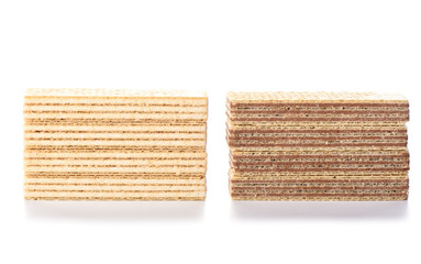 Multi-layered waffles with chocolate and white creamy fillings isolated on a white background.