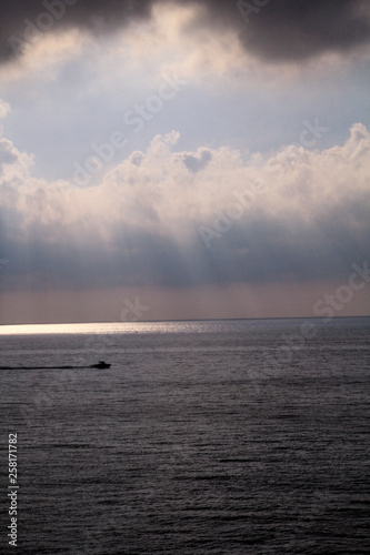 Dramatic Sunset Skies With Grey Clouds With Lines Of Sun To