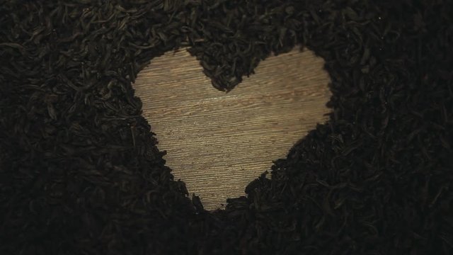 black tea heart symbol wooden table nobody hd footage 