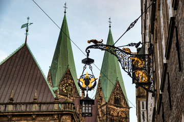 Spiers of the Cathedral of St. Peter  and sign with figures  Bremen Town Musicians  in  Bremen,...