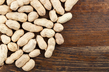 unpeeled peanuts scattered