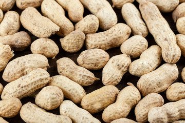 peanuts in the peel as a background