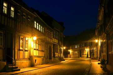 Fototapeta na wymiar Old town in Stolberg, Harz, Germany, during night with no cars and traditional half-timbered houses