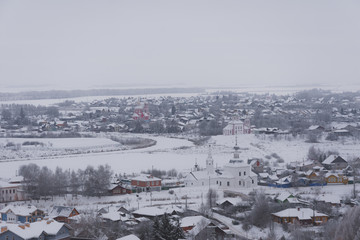  Suzdal from the height of the bell tower in the winter day.