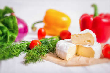 Cheese and vegetables on a white background