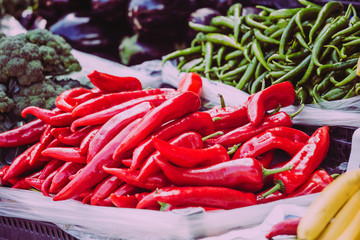 Red and green peppers on the counter of the Turkish market.
