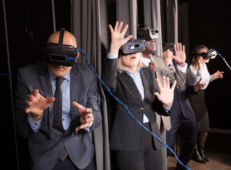 Fototapeta na wymiar Excited man in virtual reality room
