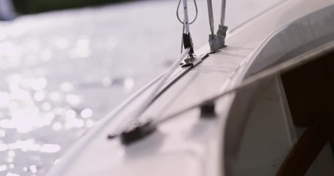 Close up of sailboat railing with ropes