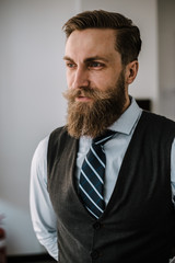 Handsome young bearded businessman