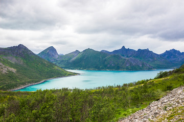 Obraz premium clouds over a fjord in the mountains on Senja island in Norway