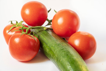 five organic tomatoes and cucumber