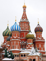 Fototapeta na wymiar Moscow, Russia - January 31, 2019: Saint Basil's Cathedral covered with snow in Red Square on a cloudy day