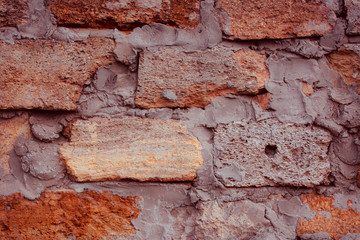 Old textured brick wall with natural defects. Scratches, cracks, crevices, chips, dust, roughness. Can be used as background for design or poster.