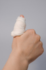 a finger in bloody bandage