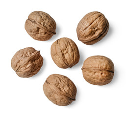 Whole walnuts on a white isolated background. View from above.