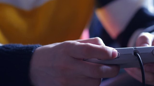 Young Woman Pressing Buttons On Controller To Play Video Game. Slider Shot.