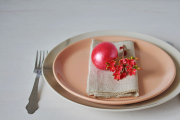 Colorful easter eggs and brushes on wooden table