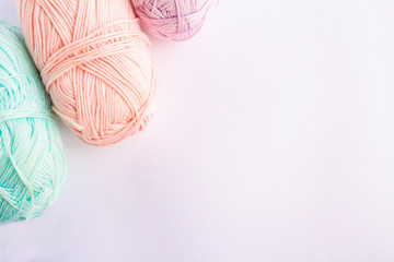 pastel colored yarn on a white background