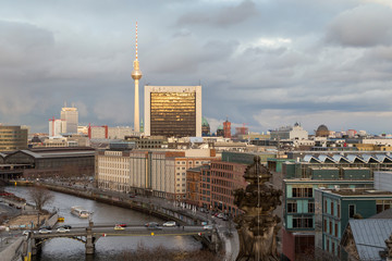 View of the Spree River, Fernsehturm TV Tower and buildings at the downtown Berlin, Germany, on a late afternoon.