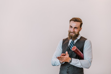 Bearded hipster graduate student with diploma