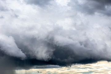 Rain cloud. Weather change. Different climatic situations in a single image.