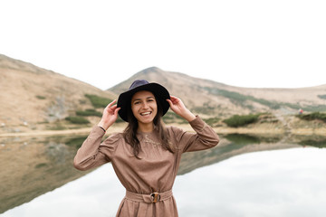 Journey of a happy girl on a valley in the mountains.