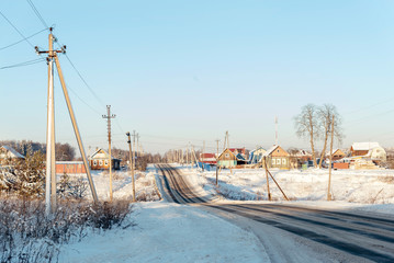 Russian winter village, snow, sun, the central part of Russia