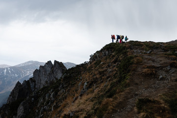 Hike group of tourists to the high mountains.