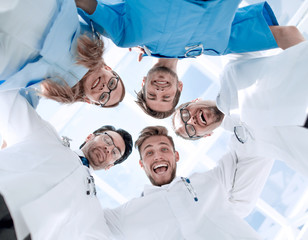 doctors looking down smiling at the camera