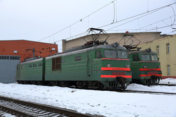 Fototapeta na wymiar Beautiful old fashioned locomotive at the railway station in winter