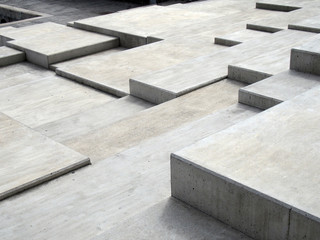 grey modern geometric cubic concrete steps forming angular patterns and shapes