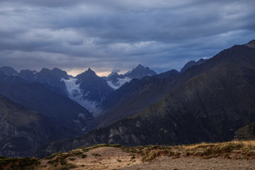 Natural landscape with view of dark rocks of Caucasus Range. Region Svaneti. Mountain landscape of Georgia. Hike to the top.