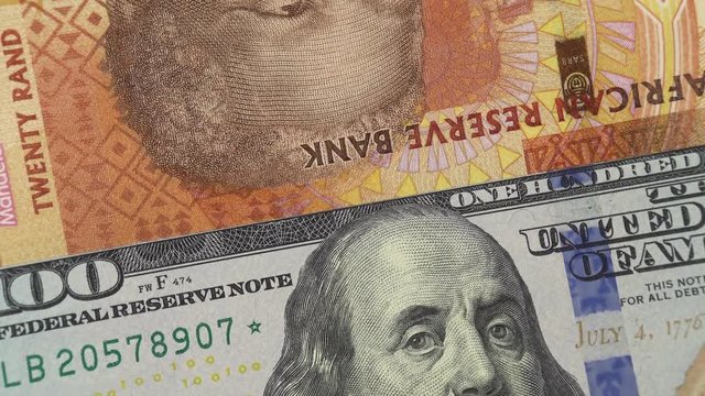 South Africa rand against US dollar bill rotating. South Africa and USA trade. 4K stock video footage
