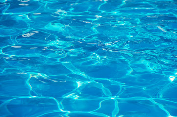 Fototapeta na wymiar water in swimming pool rippled water detail background