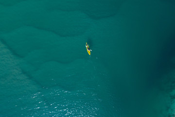 Kayak view from the sky in the middle of the ocean.