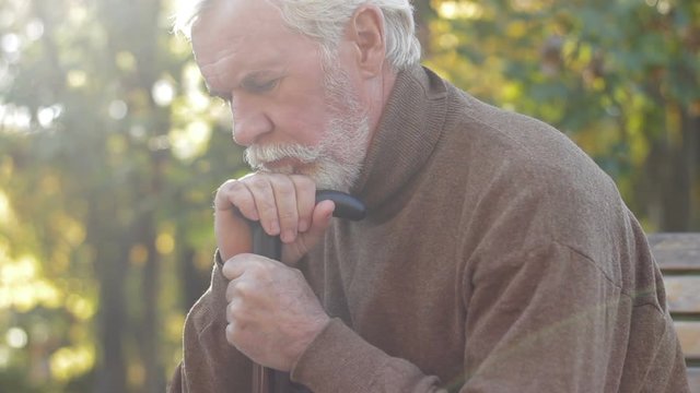 Old tired man sad about incurable desease. depressive disorder of older adults