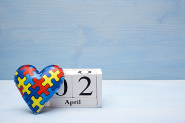 World Autism Awareness day, mental health care concept with puzzle or jigsaw pattern on heart with...