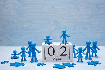 doll children background with symbolic autism puzzle pieces and calendar