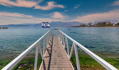  View on the Red Sea from swimming footpath on central public beach of Eilat - famous resort and recreational city in Israel and Middle East