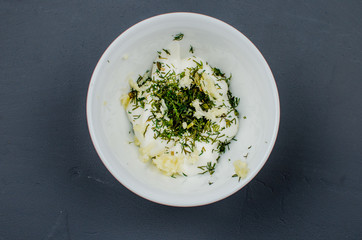 Toasts are fried on a frying pan with spices. Served on a white plate with garlic sauce and barbecue sauce