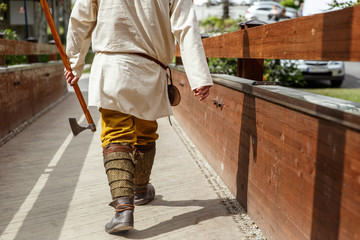 Viking man walking with an ax